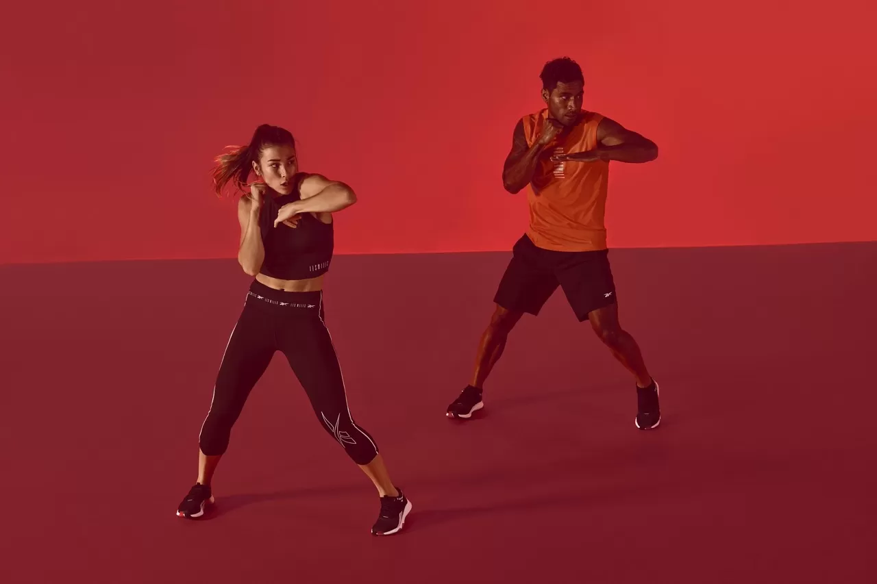 man and woman doing BODYCOMBAT workout