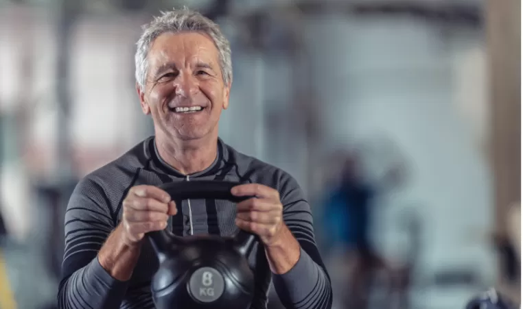 man lifting a kettlebell