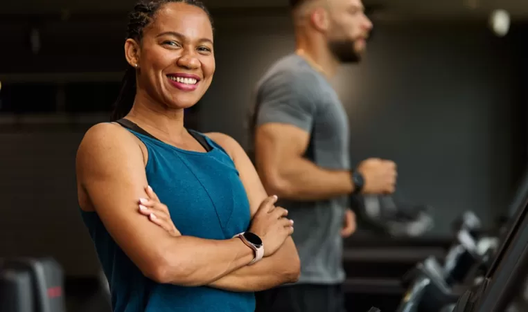 woman smiling on a treadmill