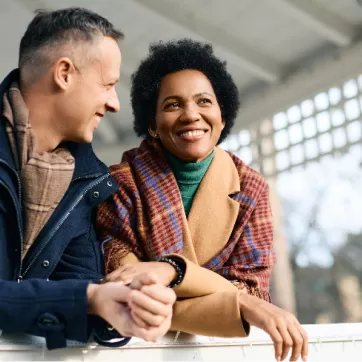 man and woman smiling outside in the winter