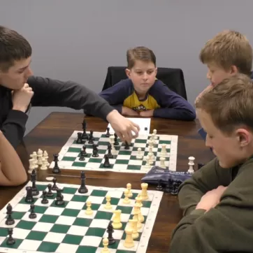 5 kids playing chess