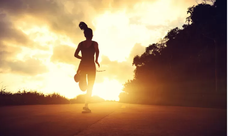woman running at sunrise