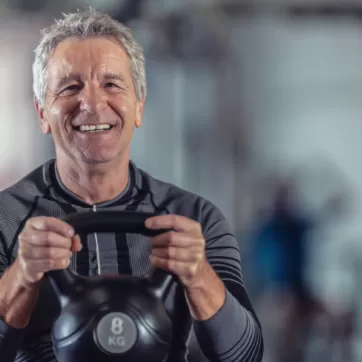 man lifting a kettlebell
