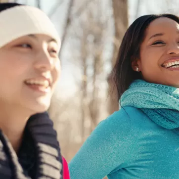 2 women walking outside in winter