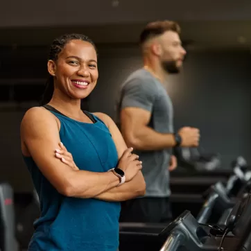 woman smiling on a treadmill