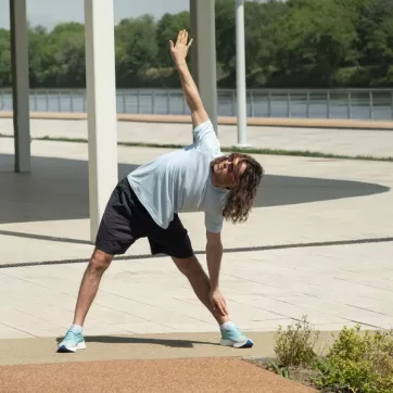 man doing a fitness warmup outdoors