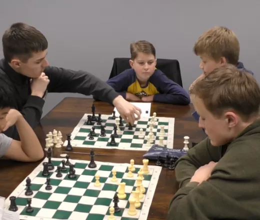 5 kids playing chess